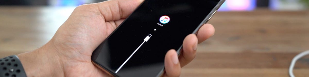 How do I sync my iPhone or iPad to iTunes?