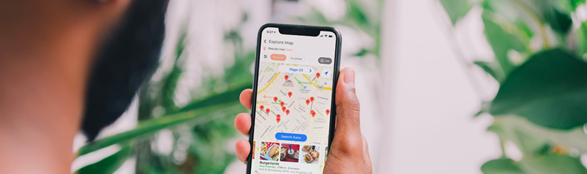Person looking at places to visit on smartphone